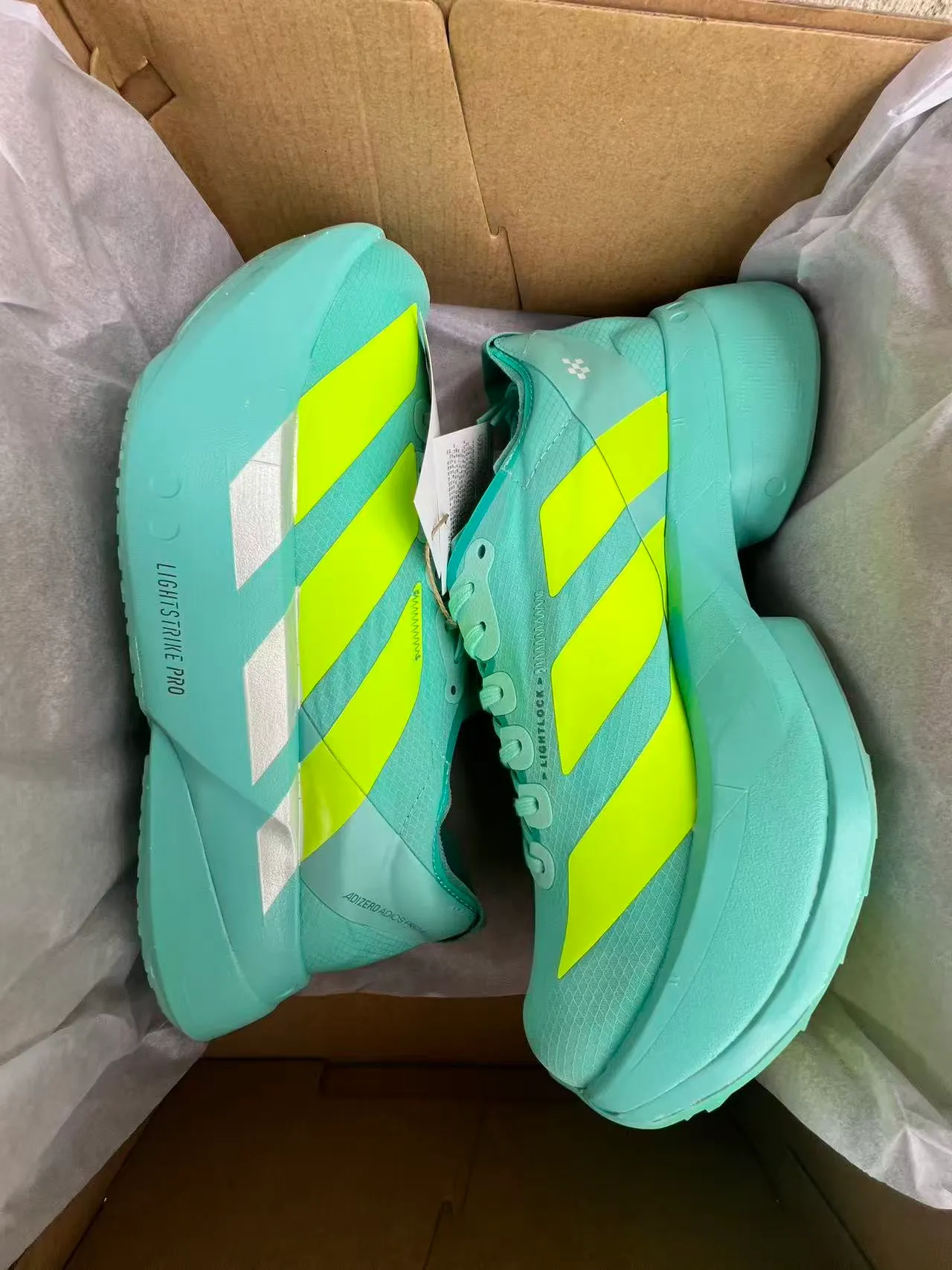 Adidas Adizero Adios Pro 4 Lightstrike Pro Cyan Neon Yellow zapatillas de running 8