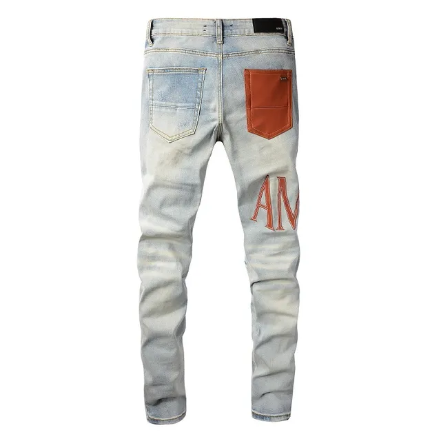 Amiri Logo Print Distressed Skinny Jeans 9