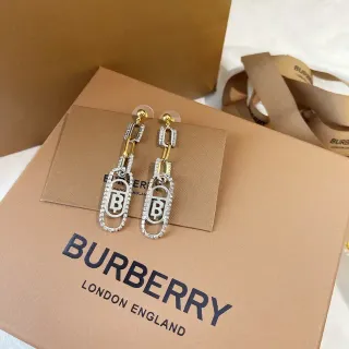 أقراط Burberry فضة وذهب مونوغرام أو فال بافي كريستال انكرستد