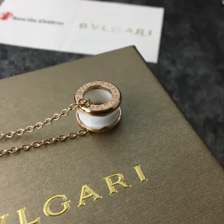 Bvlgari B.zero1 Gold White Rotating Cylindrical Pendant Engraved Logo Band Necklace