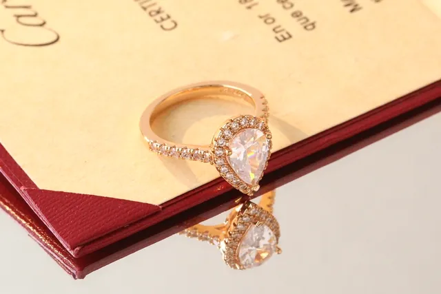 Cartier Pear-Cut Diamond Halo Pavé Ring 7