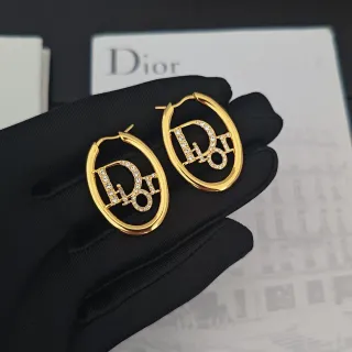 Dior Tribales أقراط ذهبية شفافة بيضاوية كريستال-باڤيه مونوغرام