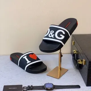 Dolce & Gabbana Slides à impression de logo noir blanc bride semelle en caoutchouc moulé mules