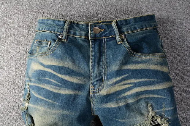 Jeans bleus slim-fit déchirés décolorés 10