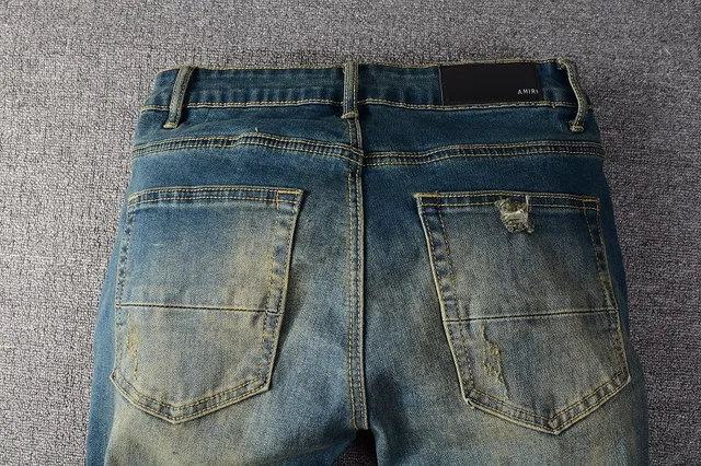 Jeans bleus slim-fit déchirés décolorés 17