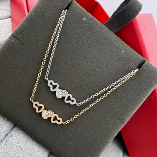 Collier motif cœur en ton doré et argenté pavé de cristaux