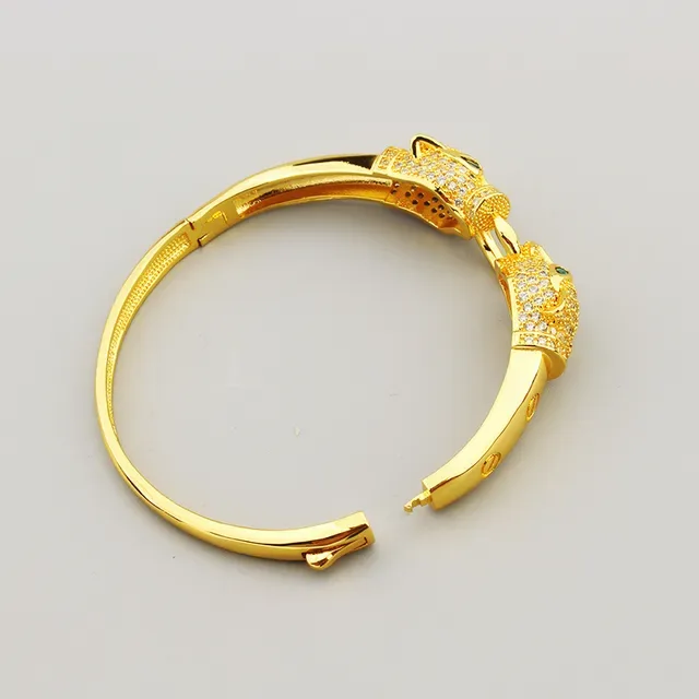 Bracelet en or avec motif tête de panthère verte pavé de cristaux clairs 4