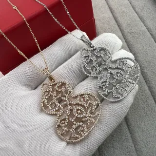Collier filigrane en forme de cœur or et argent