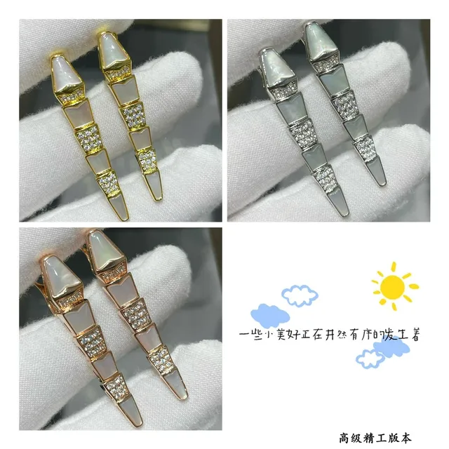 Brincos de metal em forma de adaga segmentados de ouro branco 2