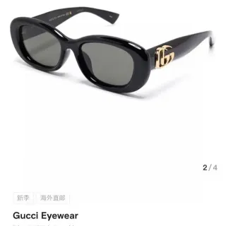 Gucci lunettes de soleil monture ovale noir et or acétate
