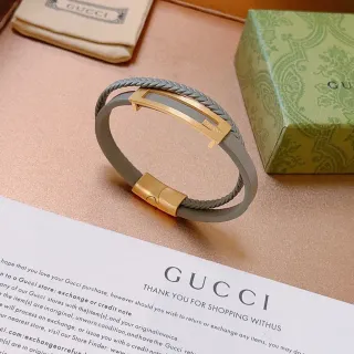 سوار Gucci جلد رمادي مضفر ذهبي