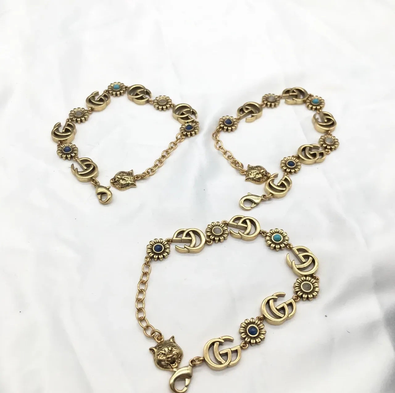 Gucci সোনা নীল ধাতু Interlocking GG লিংকস ব্রেসলেট 2