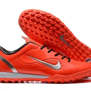 Nike Sapatos de futebol turf laranja preto com parte superior sintética e painel embossado em onda