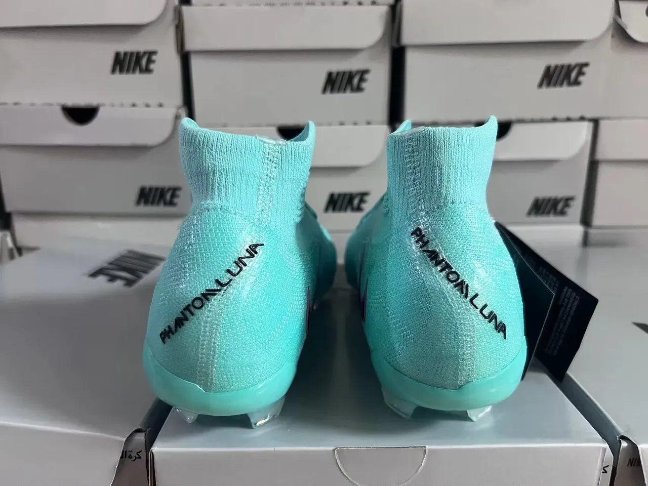 Nike Phantom GT নীল বেগুনি হাই-কাট সক-ফিট উপর ফ্লাইক্নিট নির্মাণ দৃঢ় মাটি ফুটবল জুতা 14