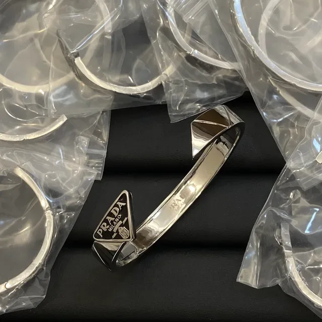 Prada Gold Black Metal Triangular Logo Plaque Bracelet 2