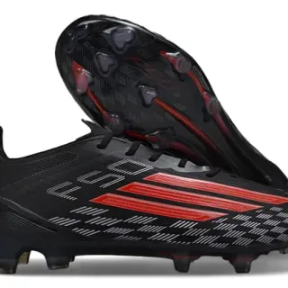 Adidas काले लाल कम-कट सिन्थेटिक अपर टेक्स्चर्ड चासिस फर्म-ग्राउंड फुटबॉल जूते