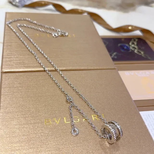 Bvlgari चाँदी सोना मल्टी रिंग घूर्णन पेंडेंट पावे डायमंड एक्सेंट्स नेस्लेस 2
