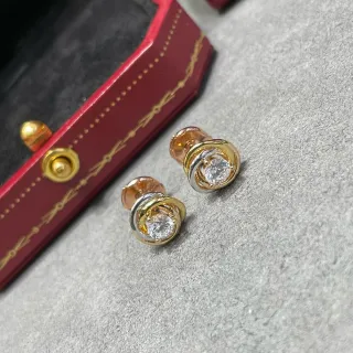 Cartier Trinity तिन-रिंग सोने और चांदी-टोन स्टड ईयरिंग्स