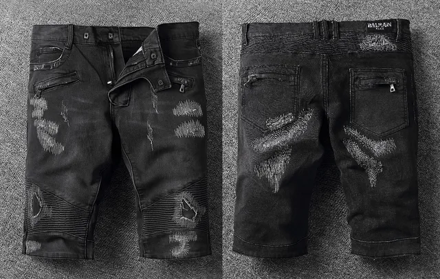 Shorts negros y blancos distressed con cremallera y bolsillos 2