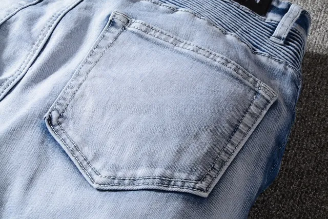 Jeans bleu et blanc distressed à poches zippées 4