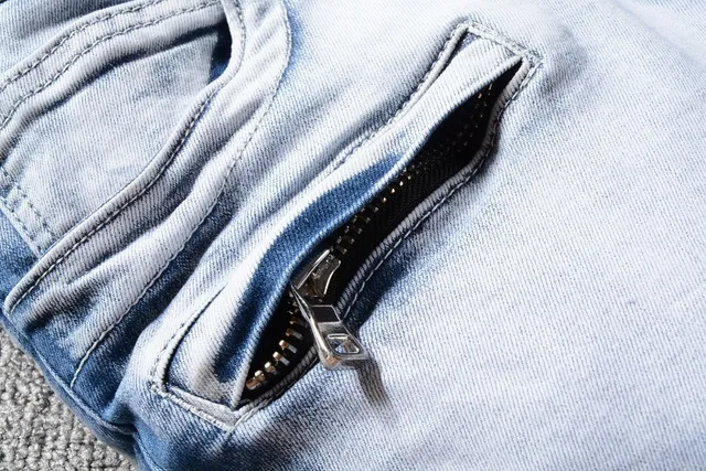 Jeans bleu et blanc distressed à poches zippées 7