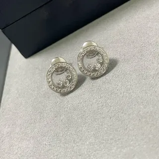Brincos de diamantes com halo flutuante em pavê circular
