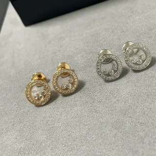 Aretes de stud con piedra flotante circular pavé en tono dorado y plateado