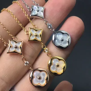Collier avec pendentifs de motif floral en or et argent avec incrustation de nacre