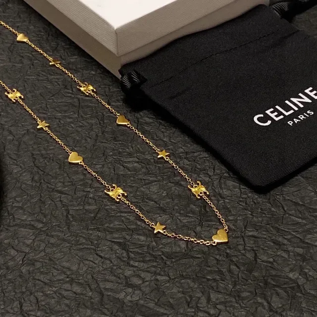 Collier chaîne avec charms de cœur et étoile en or 2