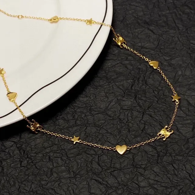 Collier chaîne avec charms de cœur et étoile en or 7
