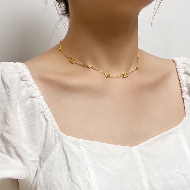 Collier chaîne avec charms de cœur et étoile en or 9