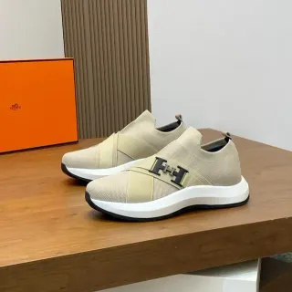 Hermès H Walk বেইজ ব্ল্যাক স্লিপ-অন নিট ইলাস্টিক ক্রস-স্ট্র্যাপ লাইফস্টাইল স্নিকার্স