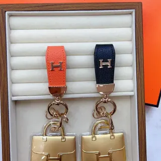 Hermès Orange Black Leather Strap Gold-Tone Metal 'H' Logo Handbag