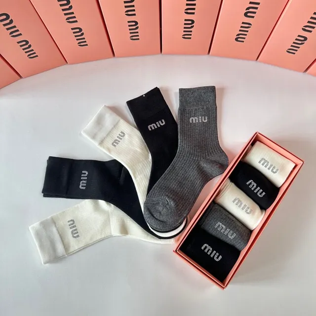 Miu Miu Chaussettes en maille ribbelée avec logo Crew 3