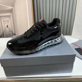 Prada Cloudbust काली पेटेंट और मेश लाइफस्टाइल स्नीकर