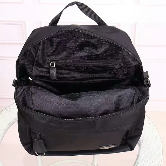 Prada Re-Edition Black Matte Nylon Construction Structured Rectangular Silhouette Casual Backpack 2