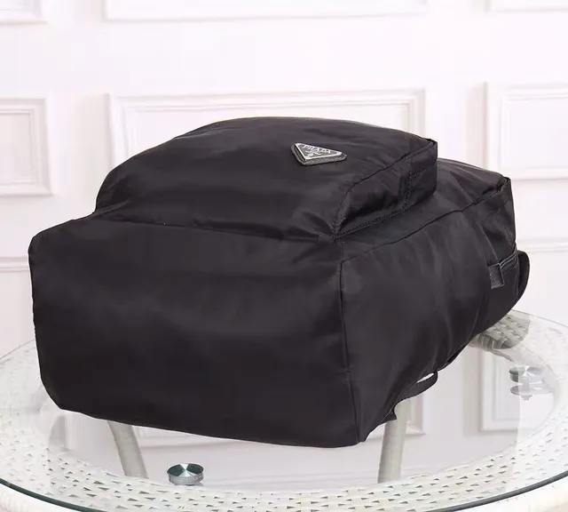 Prada Re-Edition Black Matte Nylon Construction Structured Rectangular Silhouette Casual Backpack 8