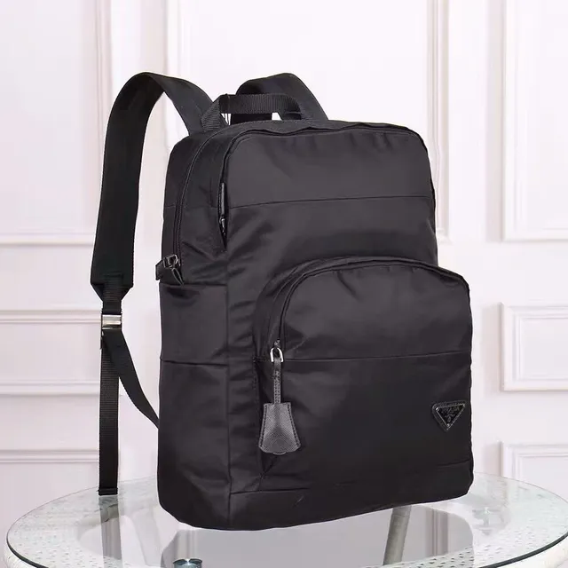 Prada Re-Edition Black Matte Nylon Construction Structured Rectangular Silhouette Casual Backpack 9