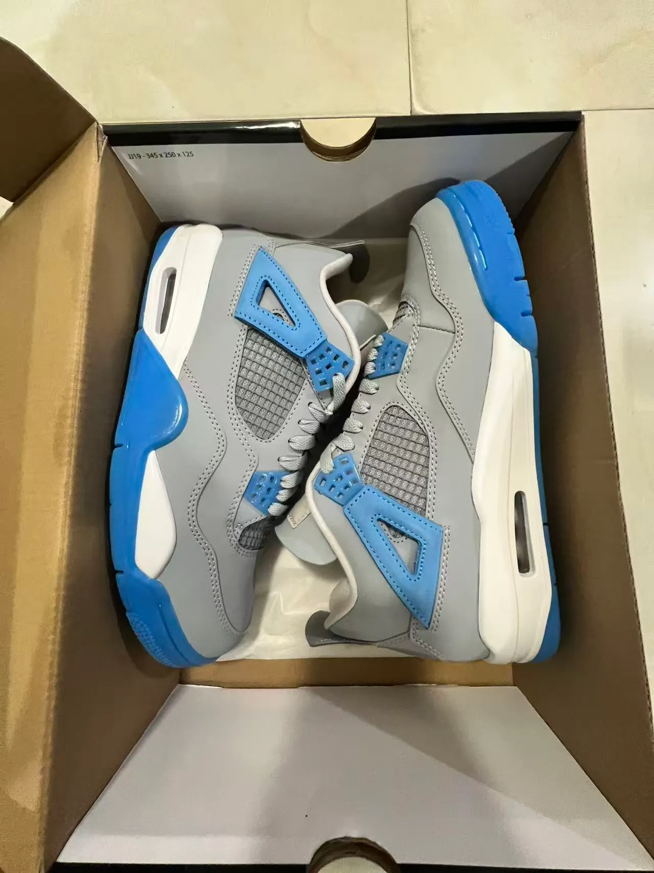 حذاء كرة السلة Air Jordan 4 رمادي أزرق أبيض 9