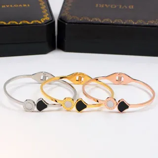 Bvlgari Gold Black Hinged Bangle Logo Medallion Bracelet