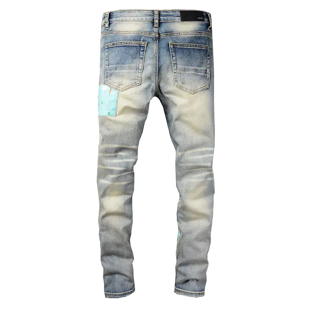 Jeans déchirés patchwork brodés bleu lavé clair 9