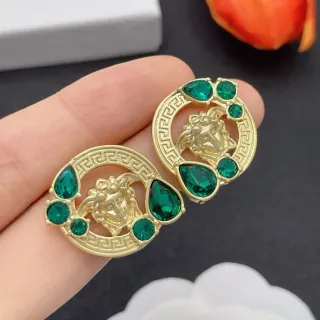 Brincos com motivo de cabeça de Medusa em ouro verde