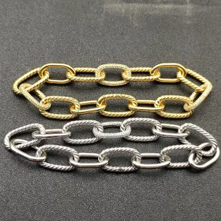 Pulsera de oro y plata con eslabones ovales gruesos y detalle de cuerda retorcida