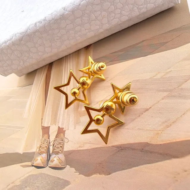 Boucles d'oreilles perles contour étoile ton doré 8