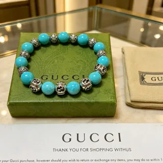 سوار Gucci GG Marmont تركواز وفضي خرز