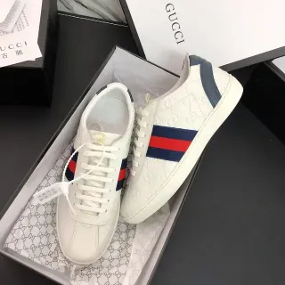 Gucci Blancas Marino Embossadas GG Monograma Detalle Franja Web Zapatillas Lifestyle