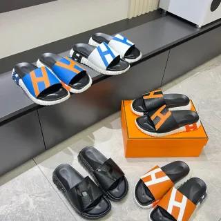Hermès Oran Slide Sandalias de cuero negro blanco naranja