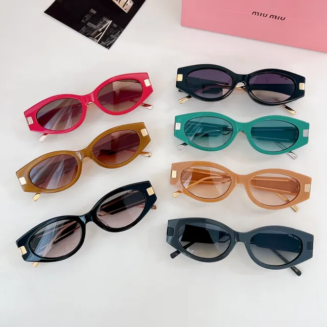 Miu Miu Lunettes de soleil cadre rectangulaire-ovale acétate noir-or épais 9