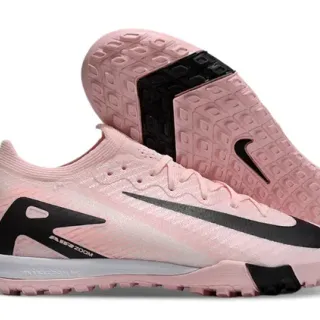 Nike tênis de futebol com upper knit rosa e preto, overlays de padrão ondulado para turf