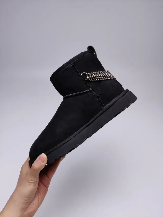 UGG Classic Mini काला सुड शियरलिंग लाइनड स्नो बूट 12